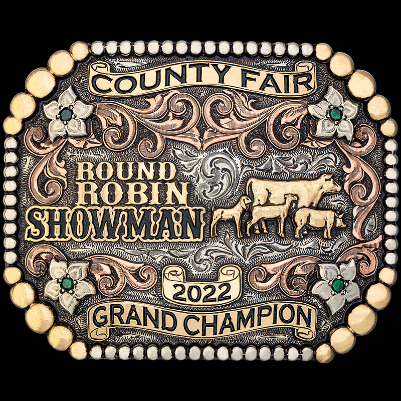 The County Fair Custom Belt Buckle features a berry edge, copper scrolls and bronze scrolls, and lettering. Customize it for a perfect rodeo trophy, gift or western accesory!